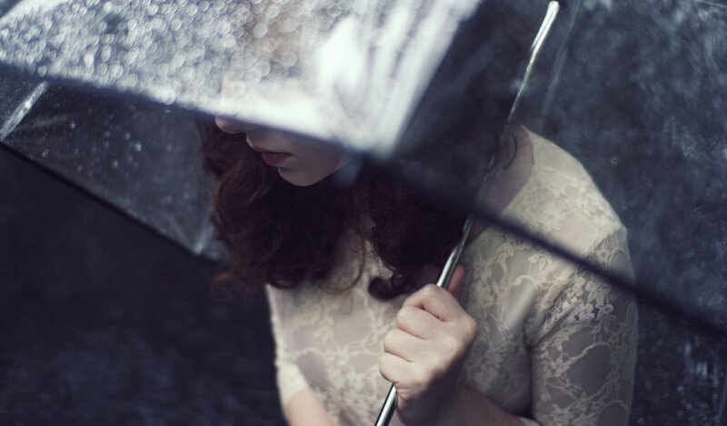 woman under umbrella in rain