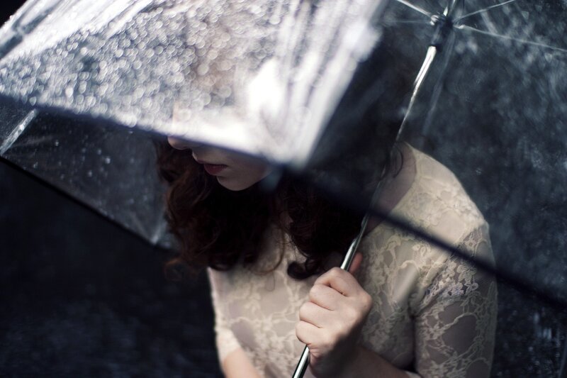 woman under umbrella in rain