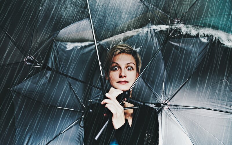 woman under umbrella in rain