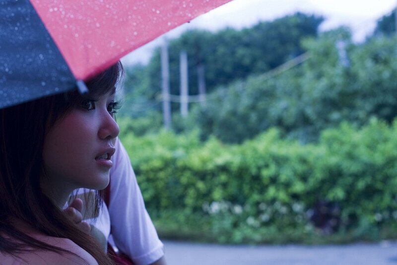 woman under umbrella in rain