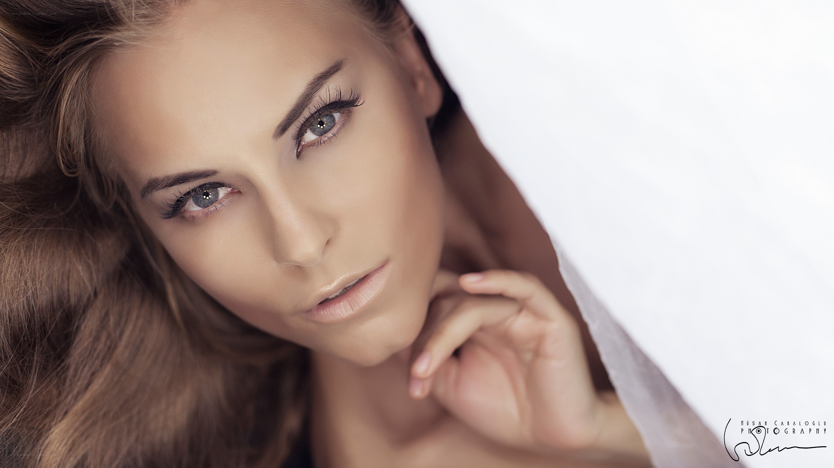 woman under white sheet