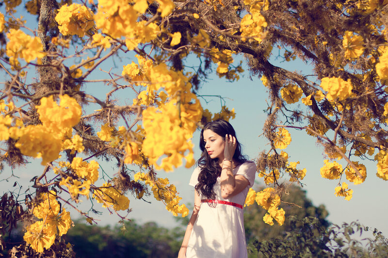 Woman under Yellow Flowers