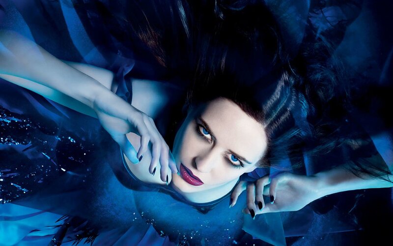 woman underwater in blue light