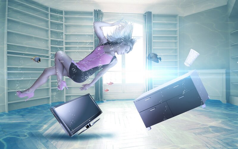 woman underwater in flooded room