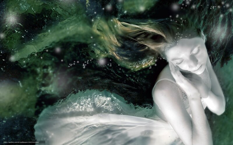 woman underwater in green light