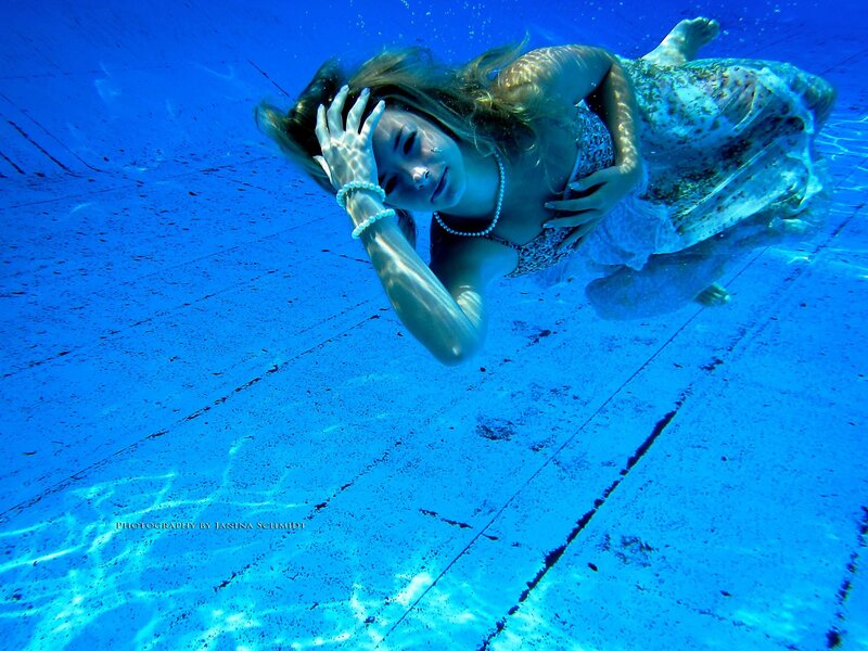 woman underwater in pool
