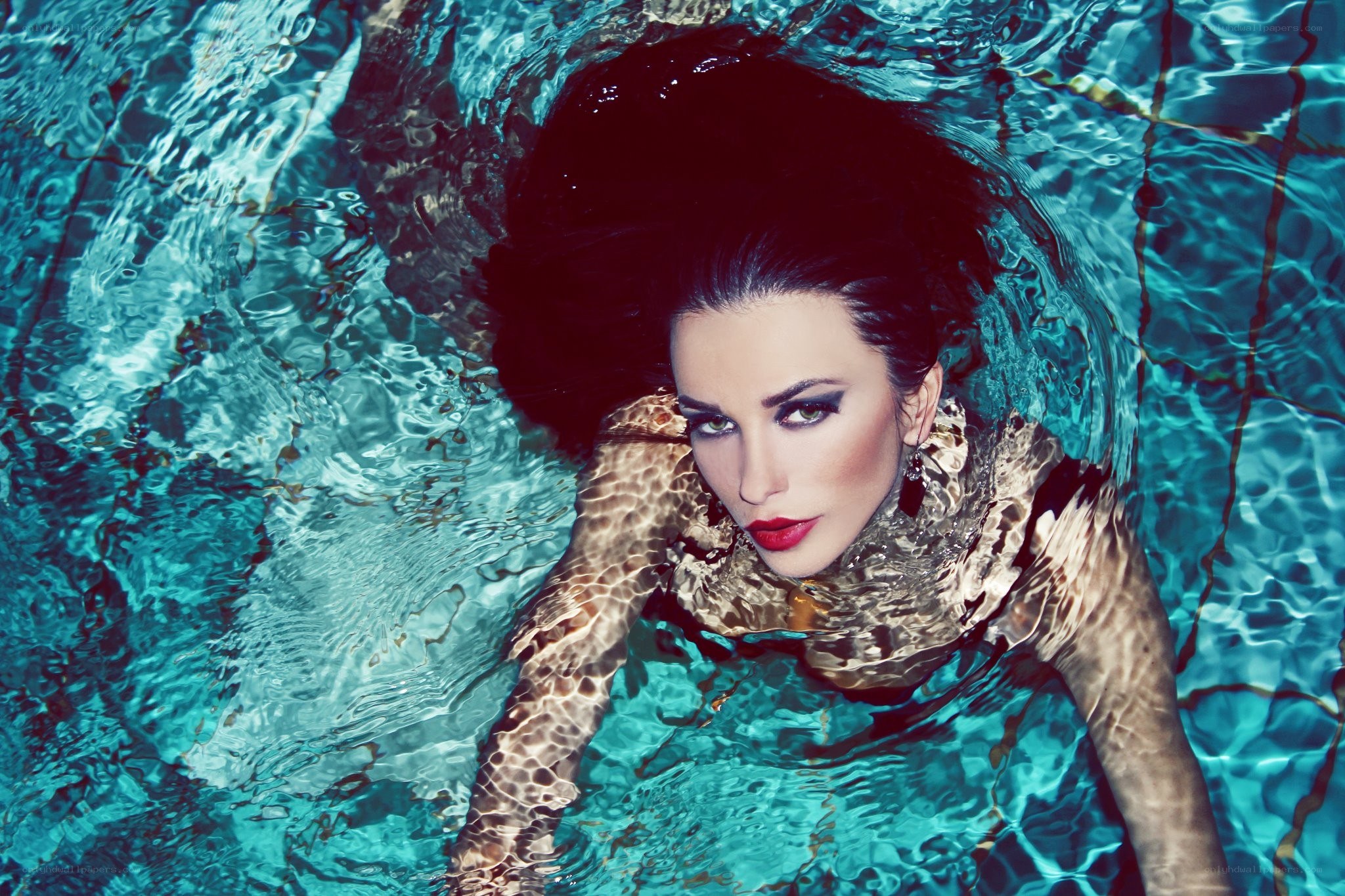 woman underwater in pool