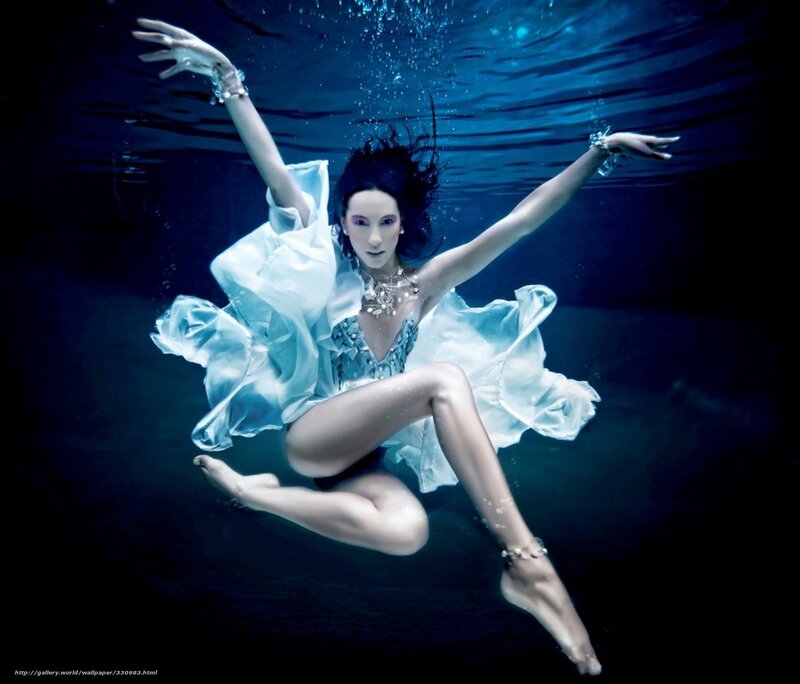 woman underwater in white dress