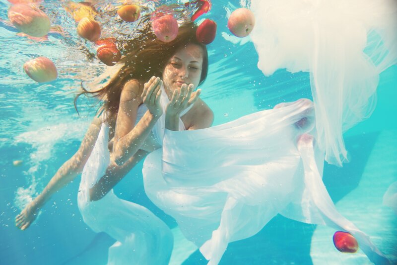 Woman Underwater with Apples