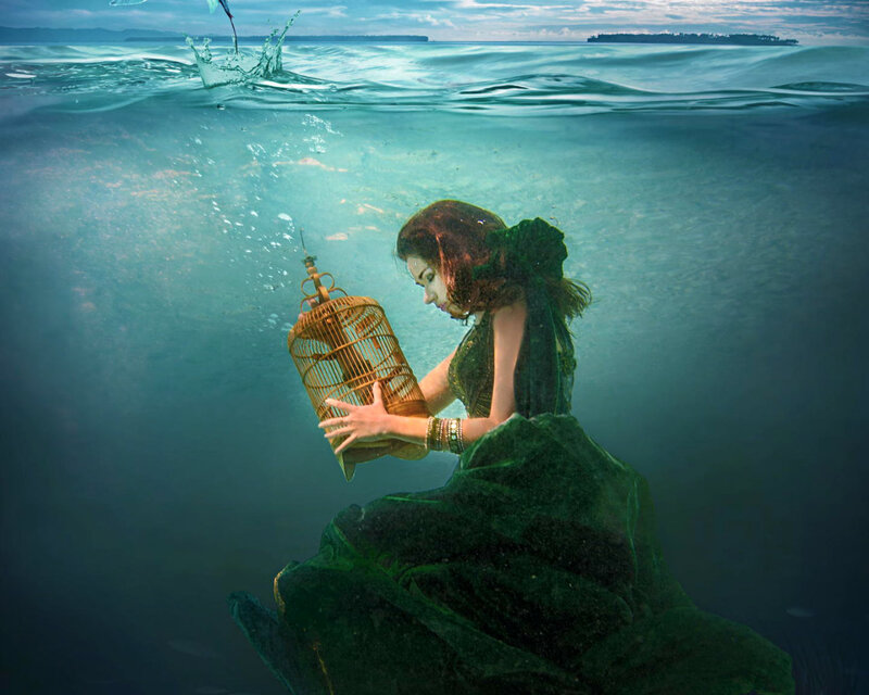 Woman Underwater with Birdcage