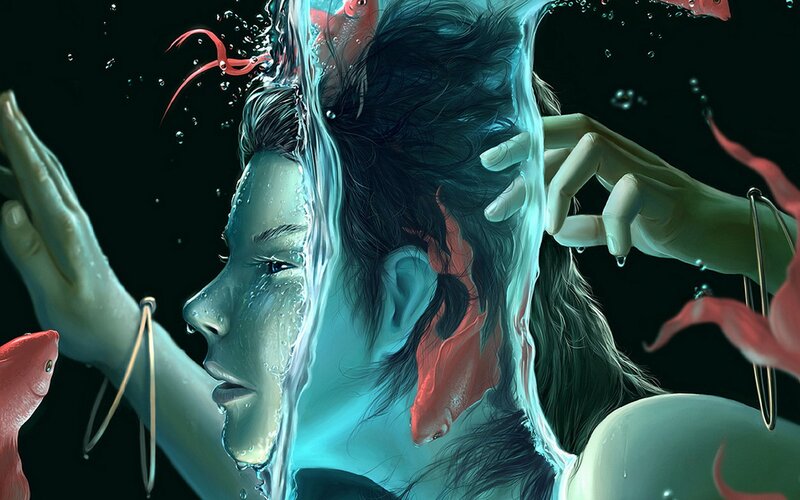 woman underwater with fish