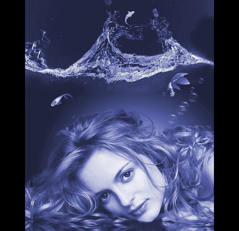 woman underwater with fish