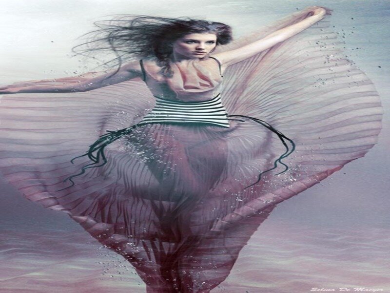 woman underwater with flowing dress