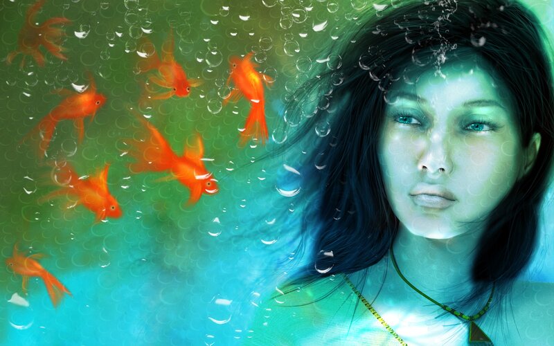 woman underwater with goldfish