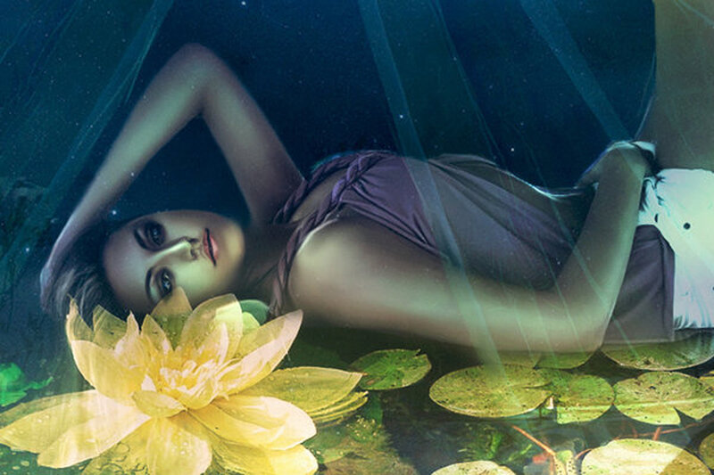 woman underwater with lotus flower