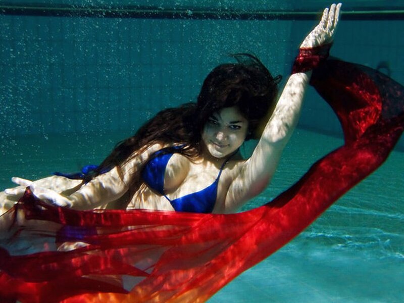 Woman Underwater with Red Fabric