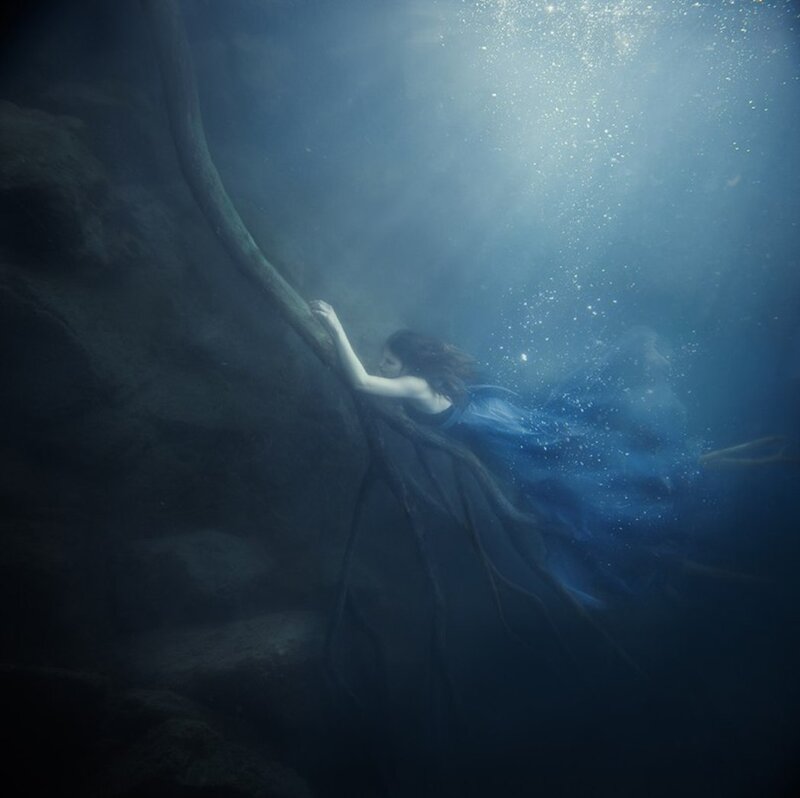 Woman Underwater with Roots