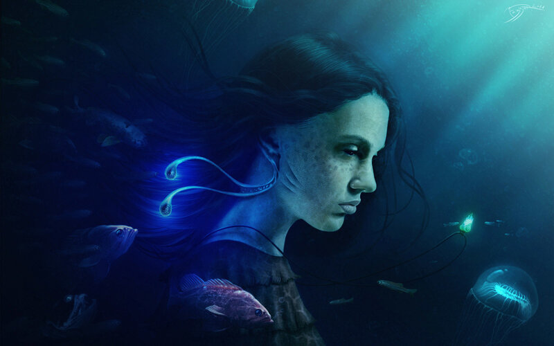 woman underwater with sea creatures