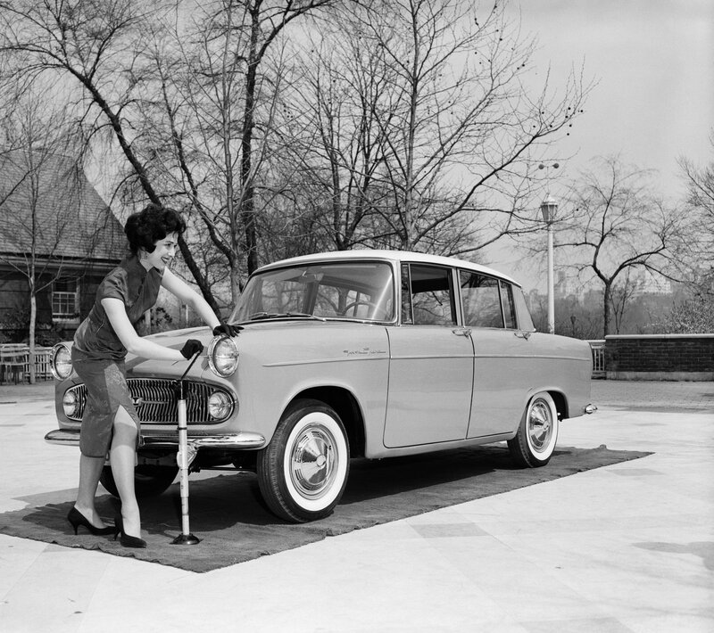 Woman using a car jack