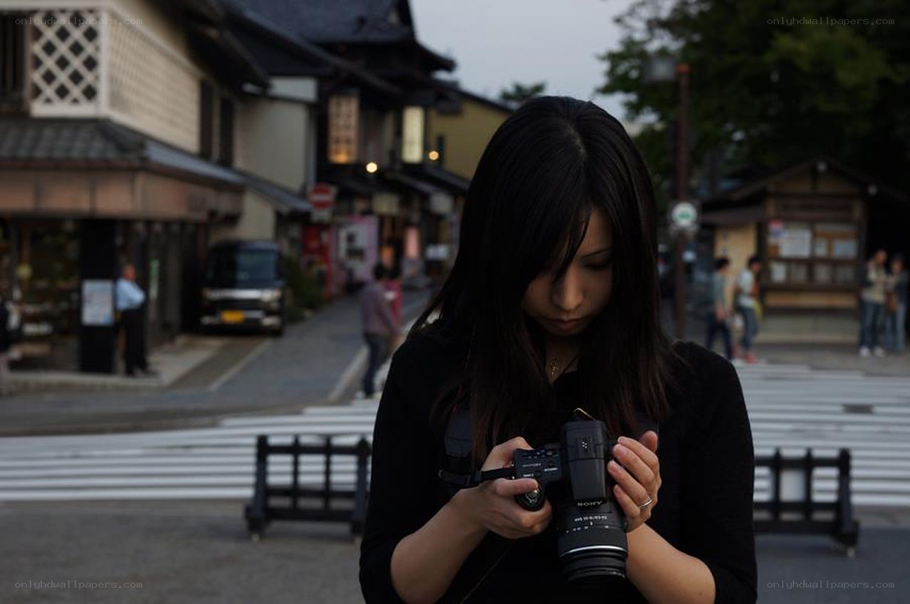woman using camera on street