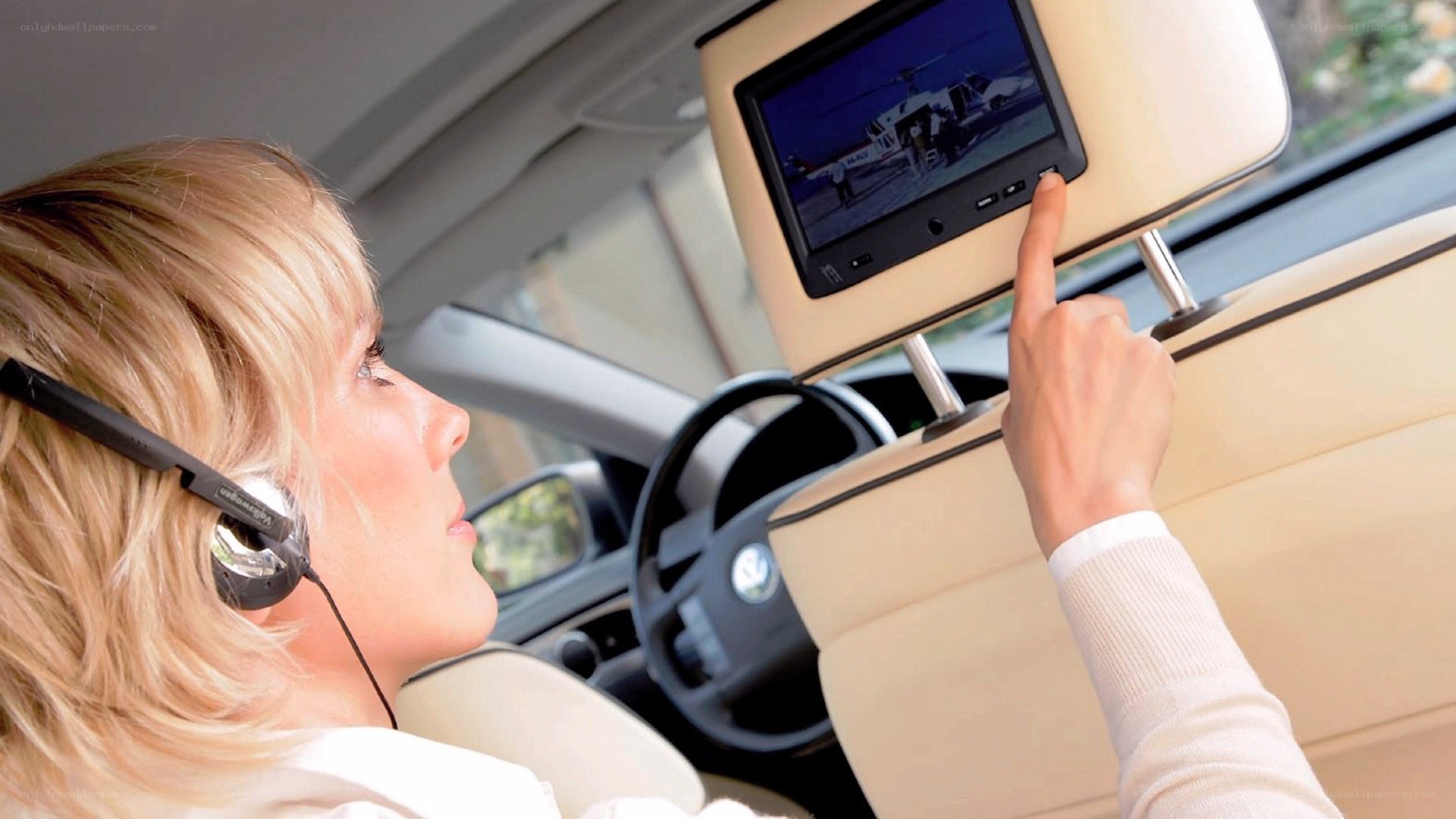 woman using car entertainment system