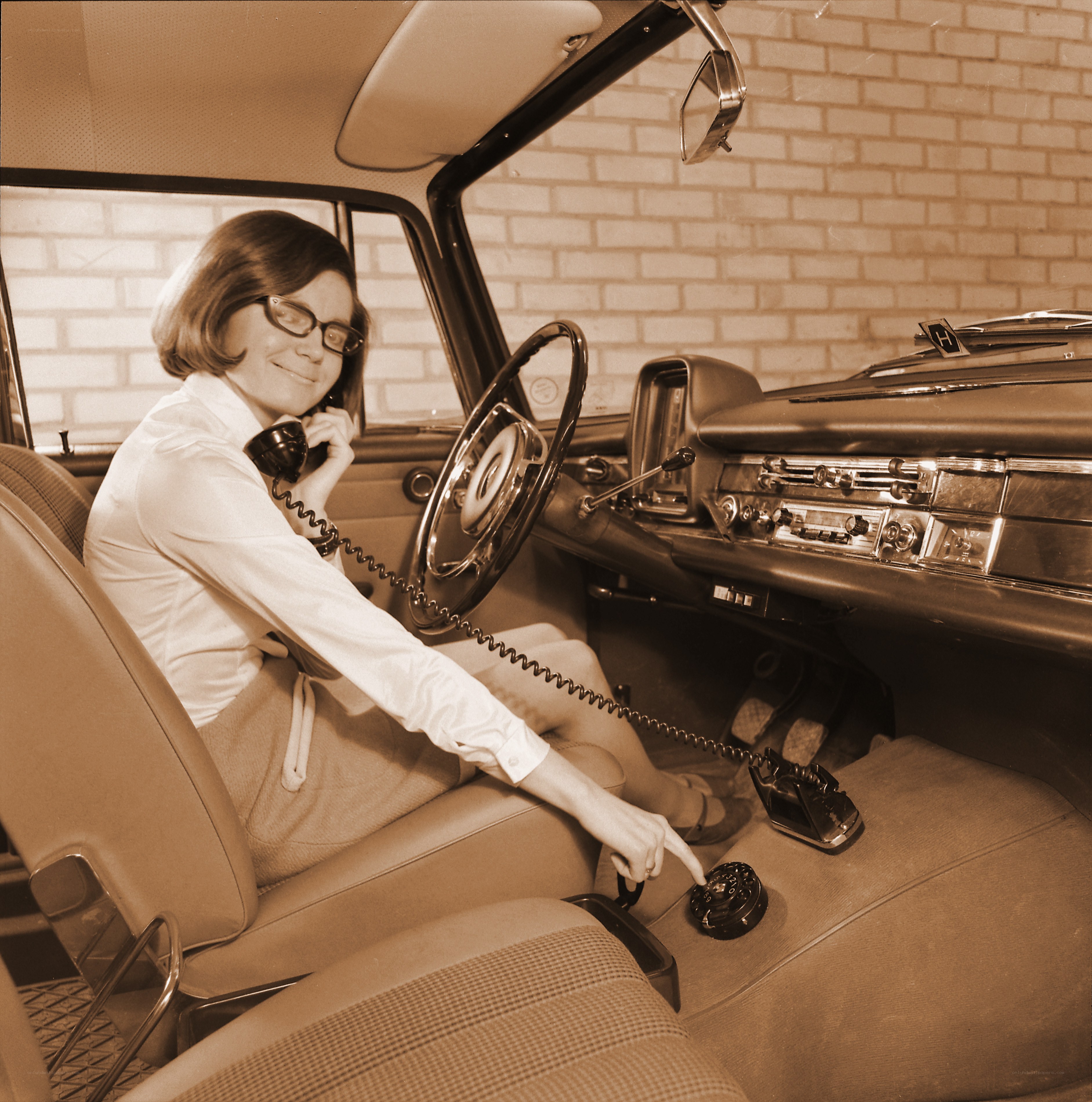 Woman using car phone