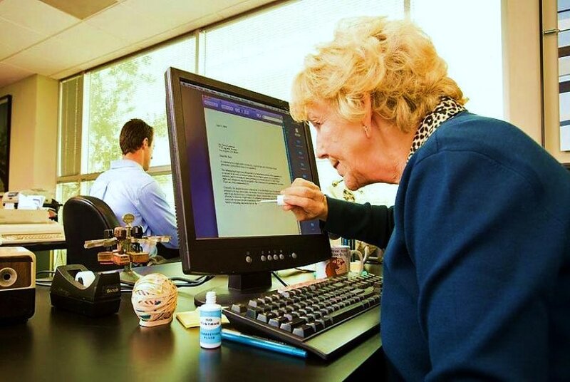 Woman using computer at office