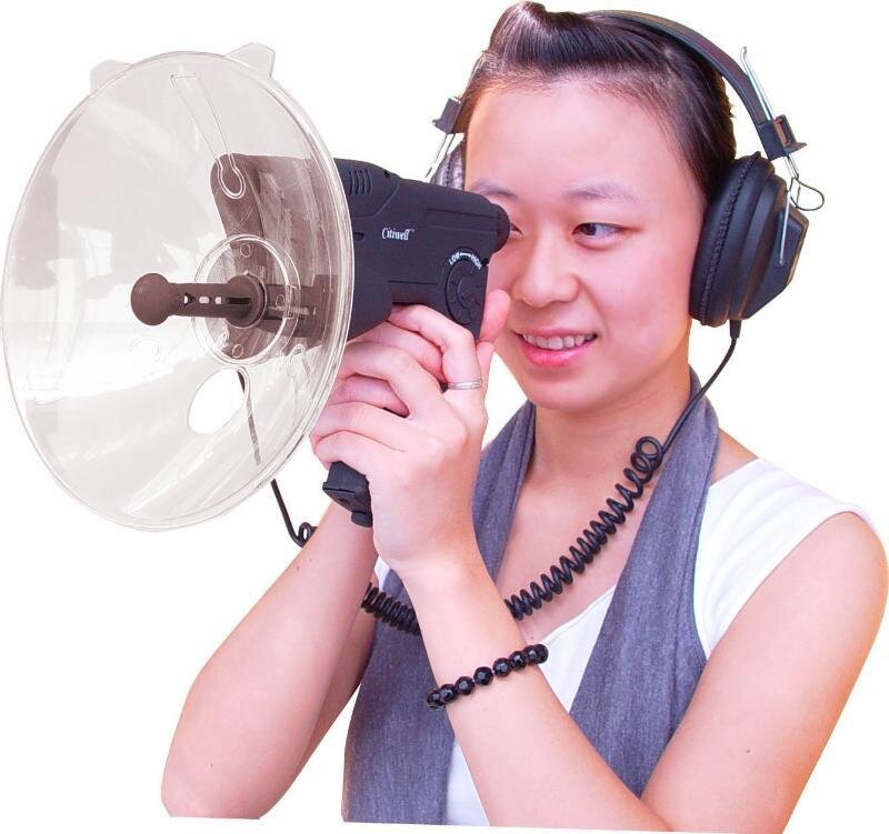 woman using hearing aid device