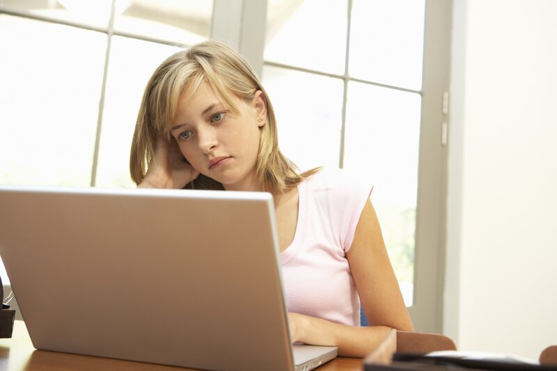 woman using laptop at desk