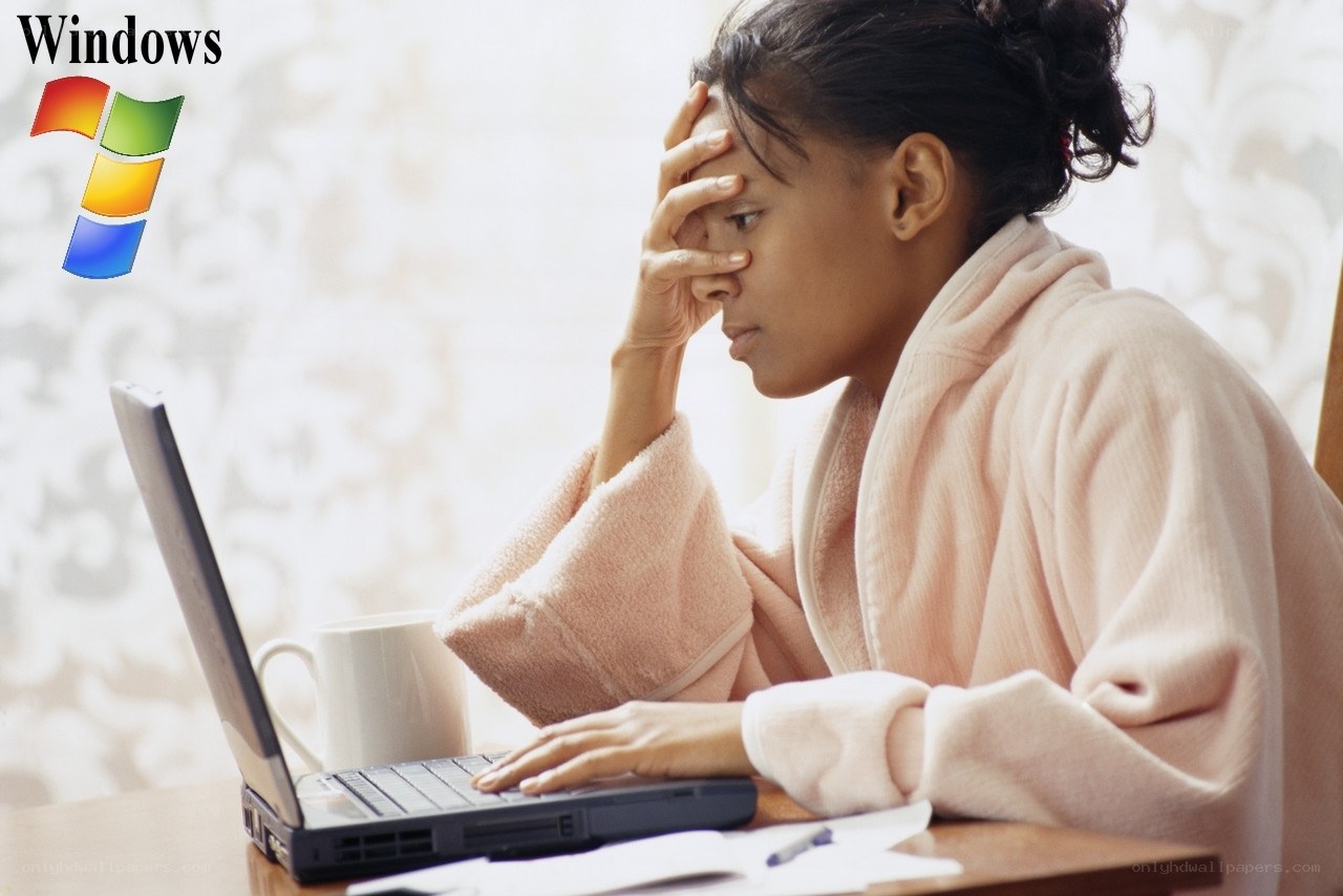 woman using laptop in bathrobe