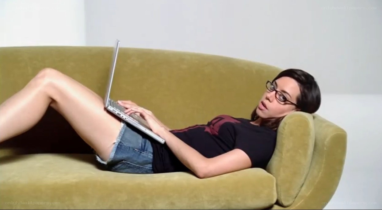 woman using laptop on couch