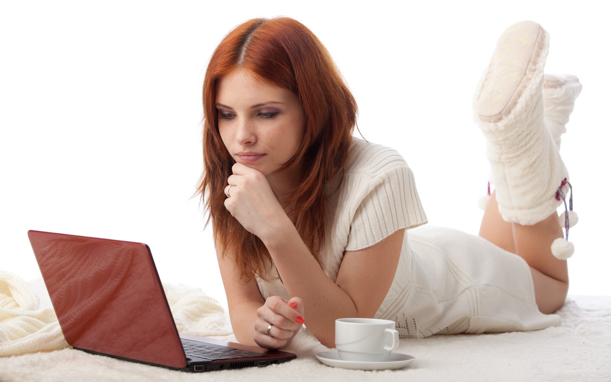 woman using laptop on floor