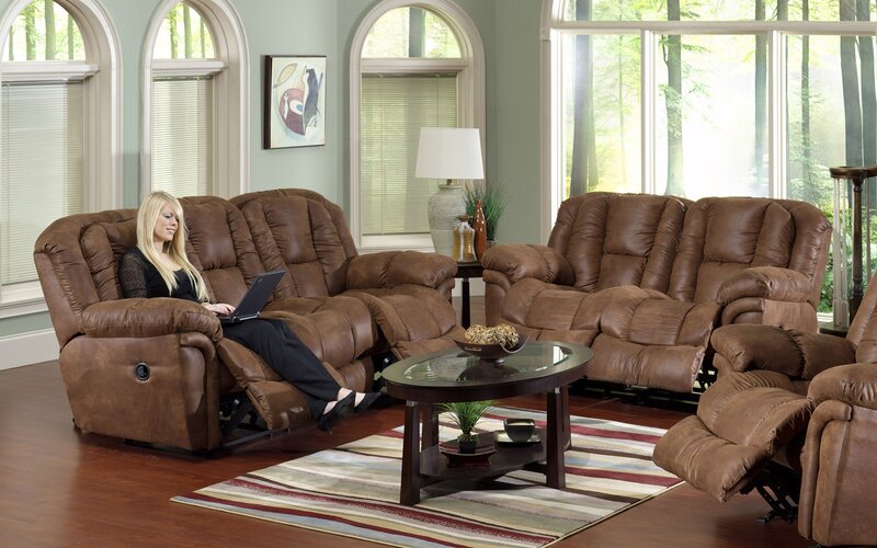 woman using laptop on recliner