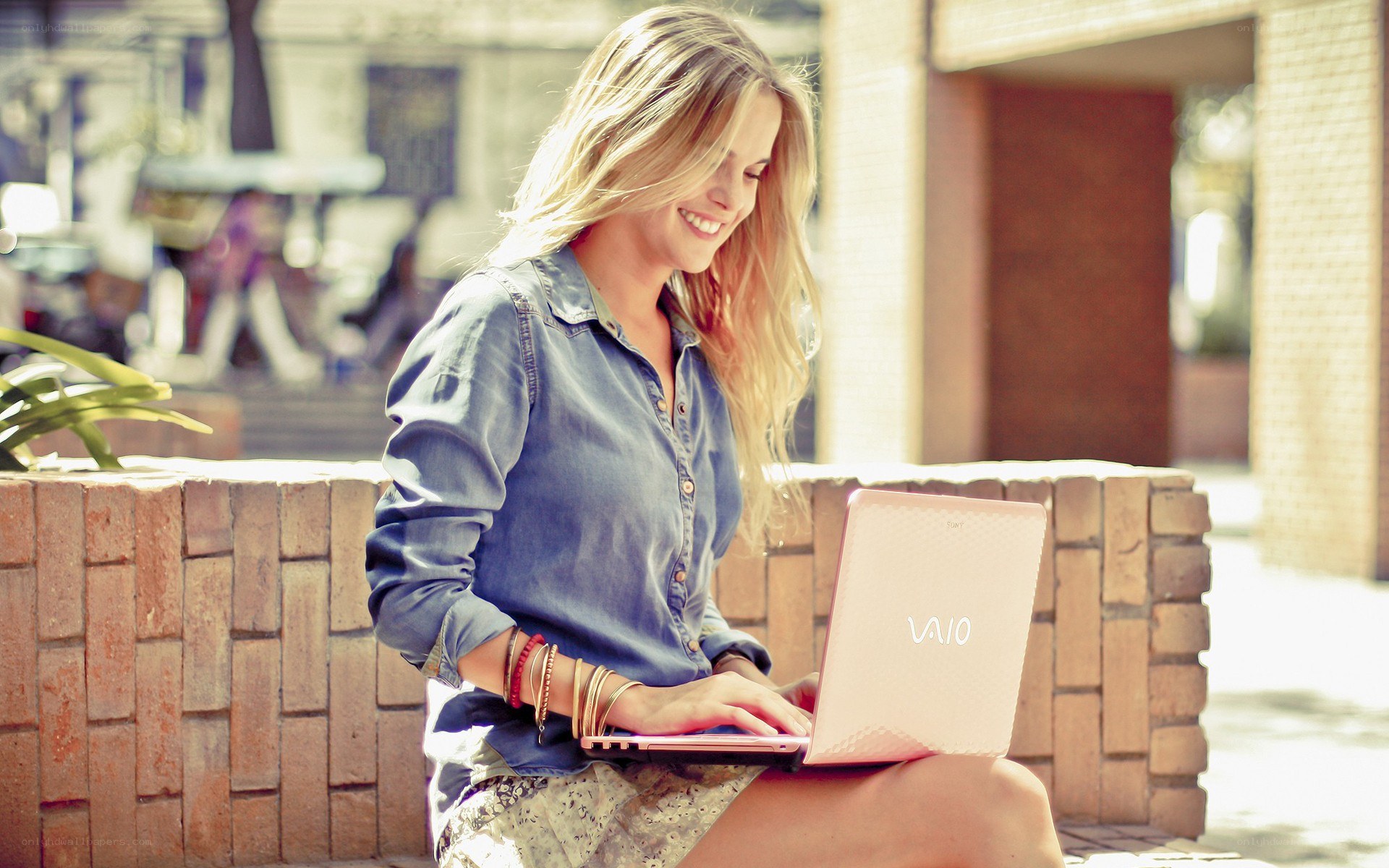 woman using laptop outdoors