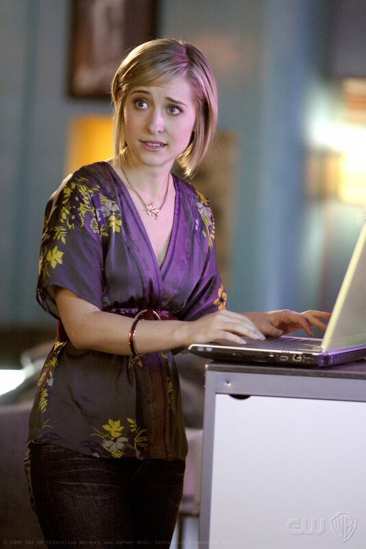 Woman Using Laptop — Purple, Concerned