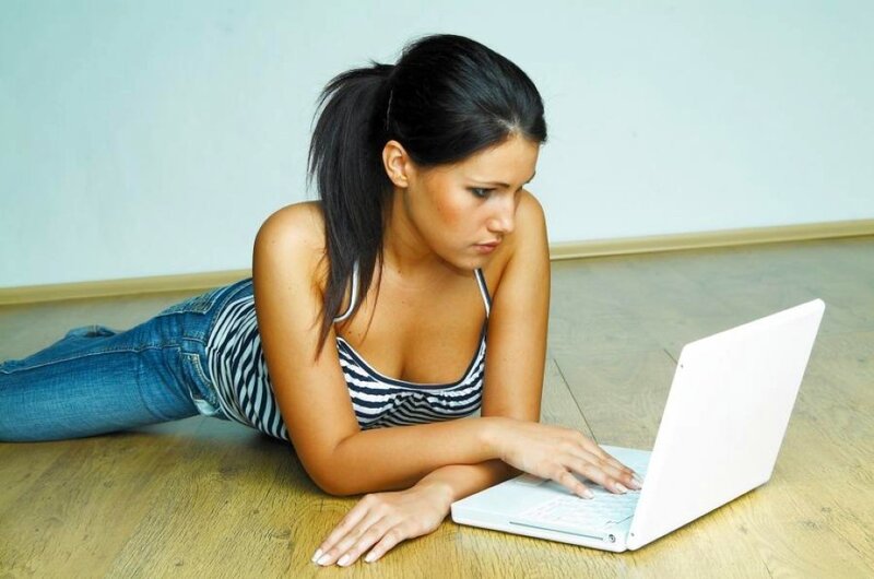 Woman Using Laptop — White