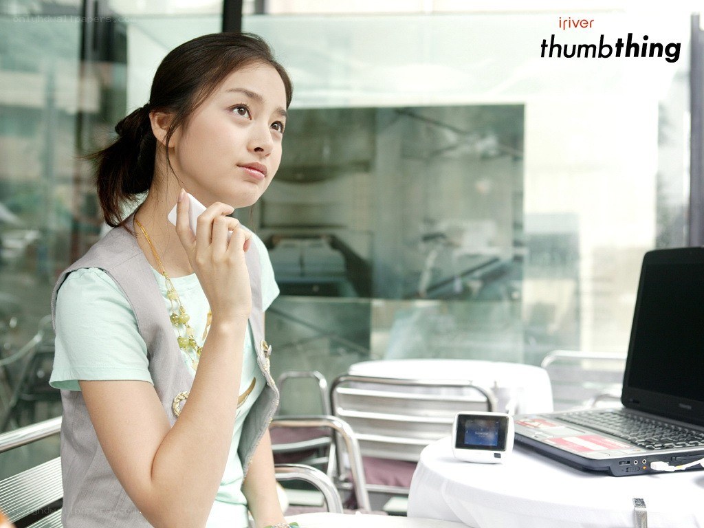 woman using phone at cafe