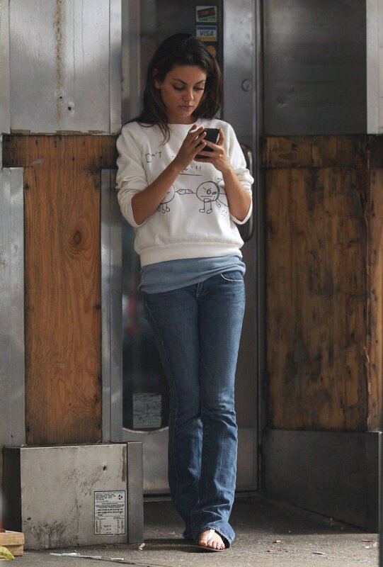woman using phone on street