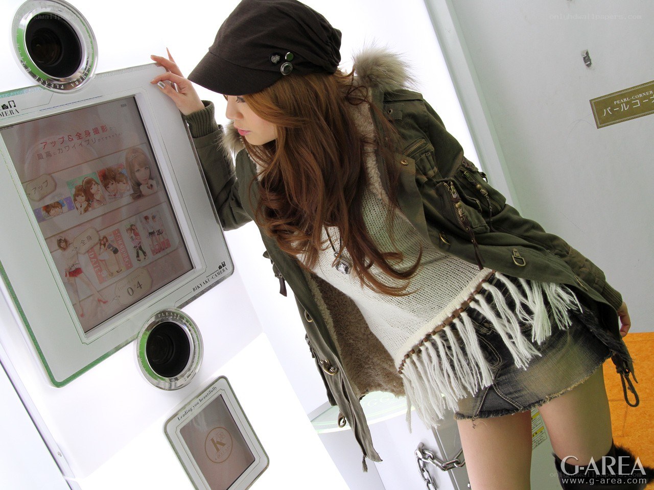 Woman using photo booth