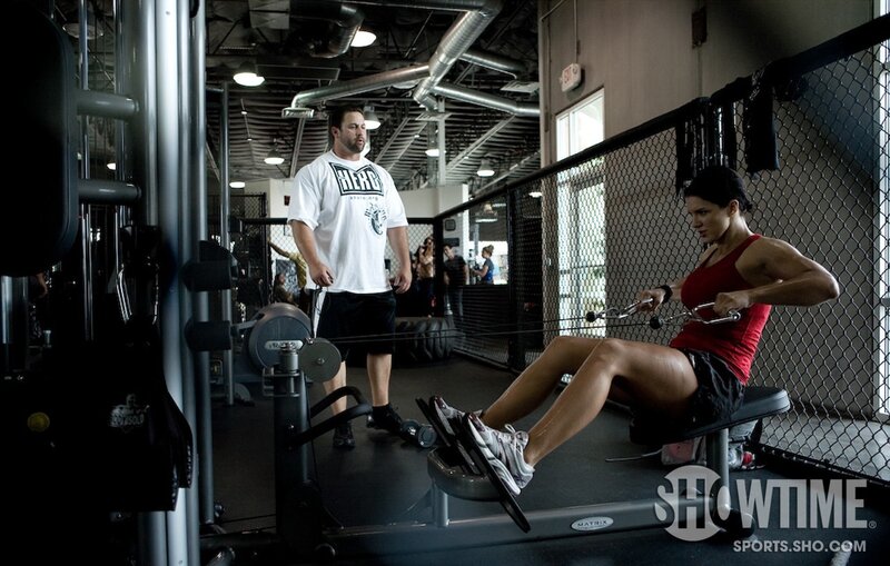 Woman Using Rowing Machine