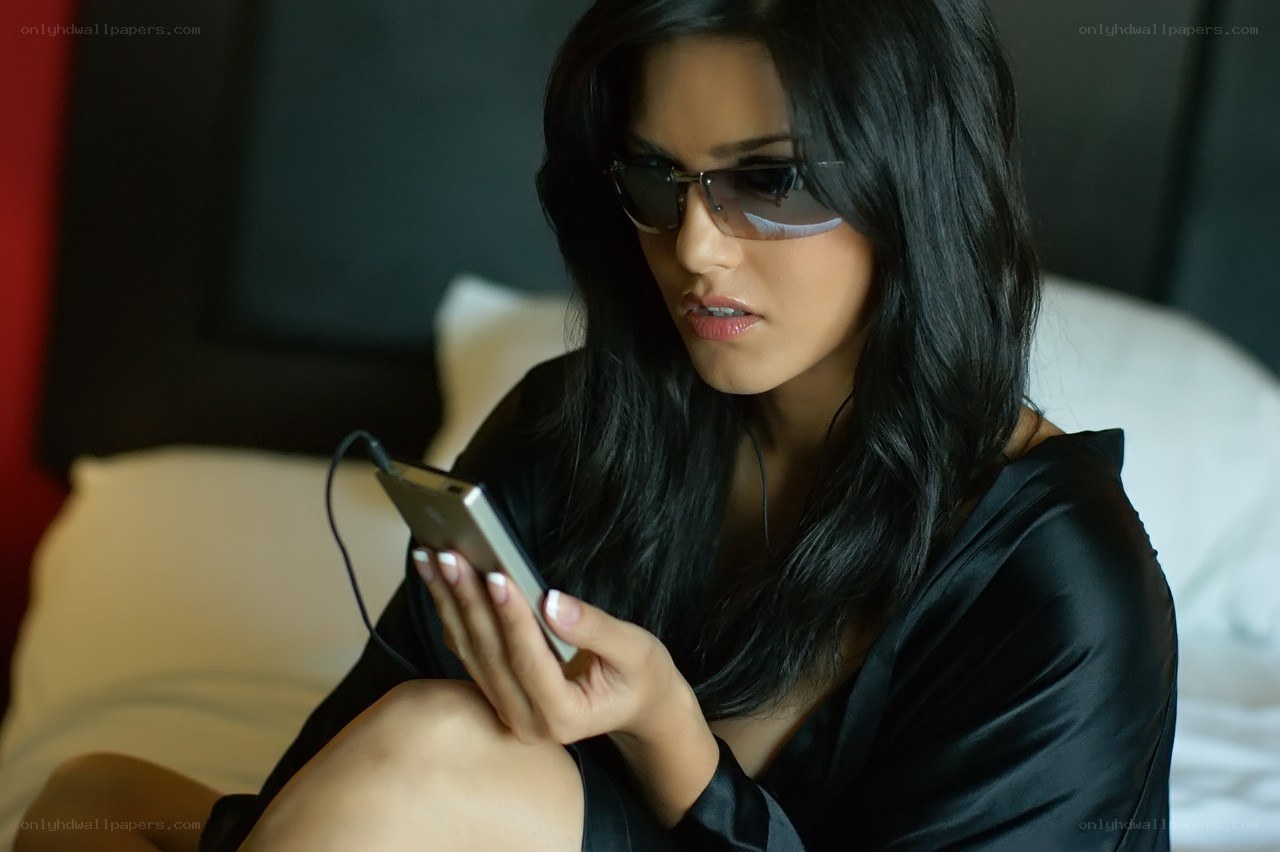 woman using smartphone in bed