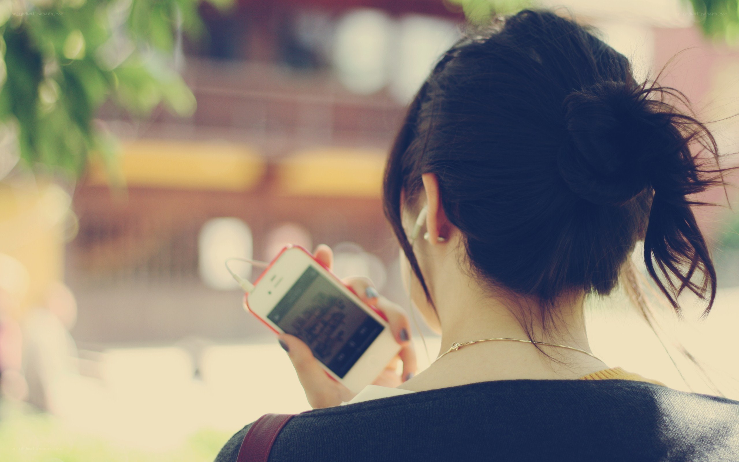 Woman using smartphone outdoors