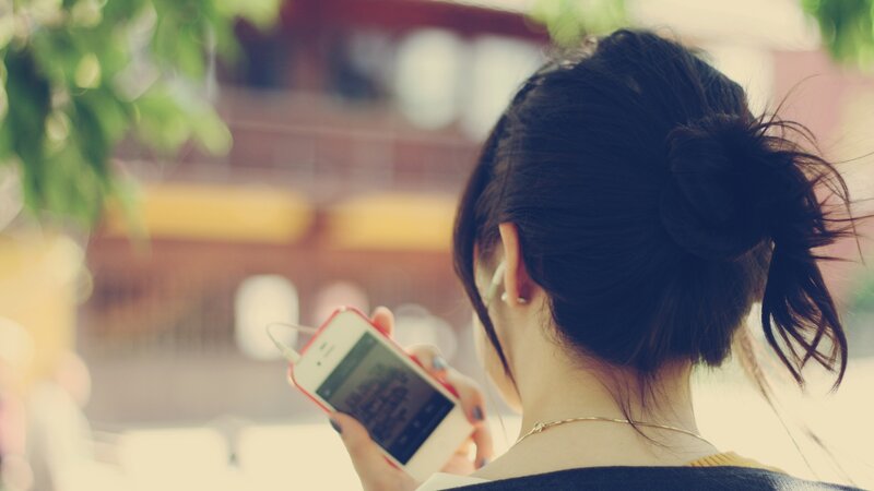 woman using smartphone outdoors