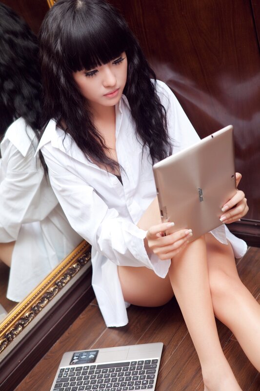 woman using tablet on floor