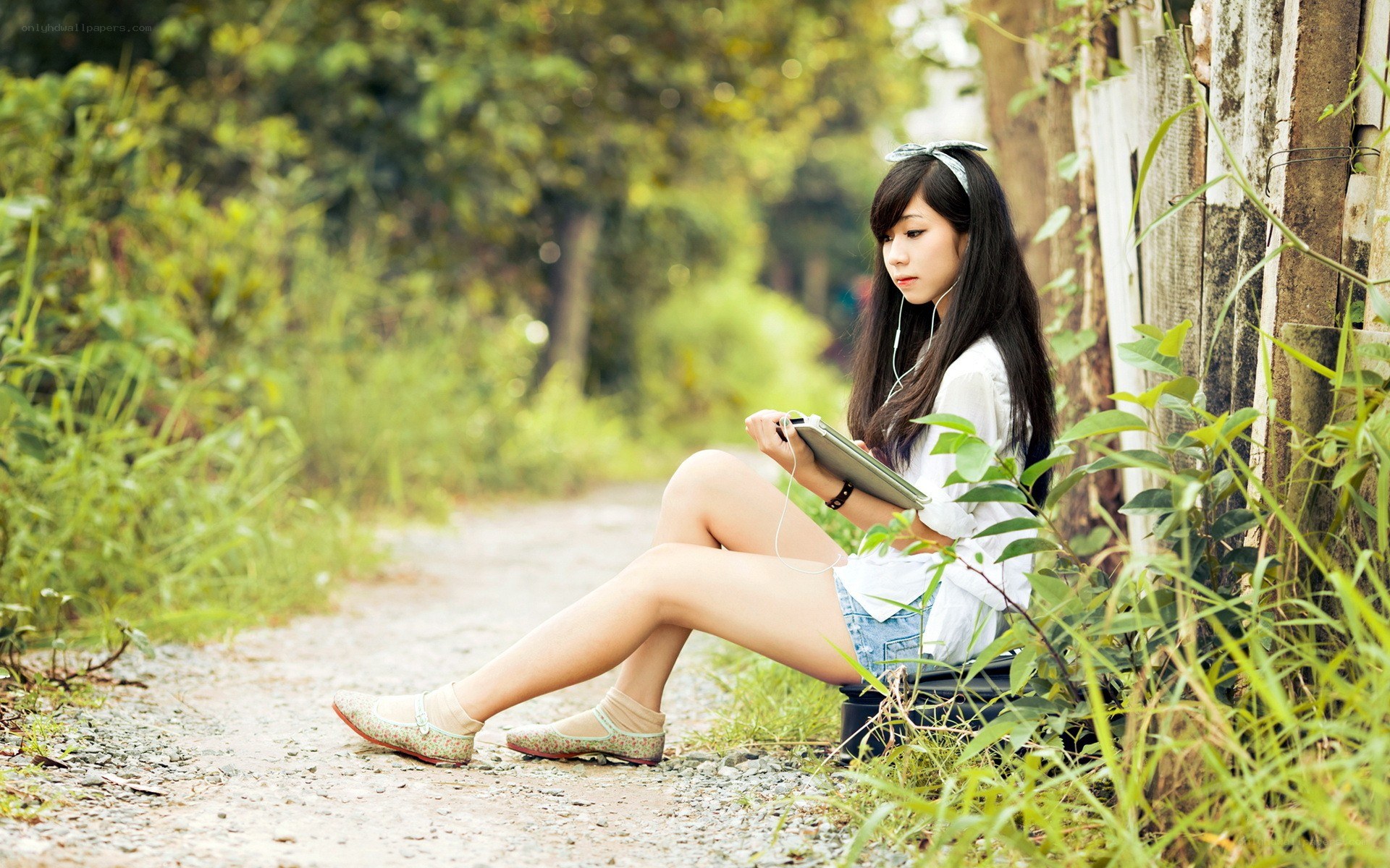 woman using tablet outdoors