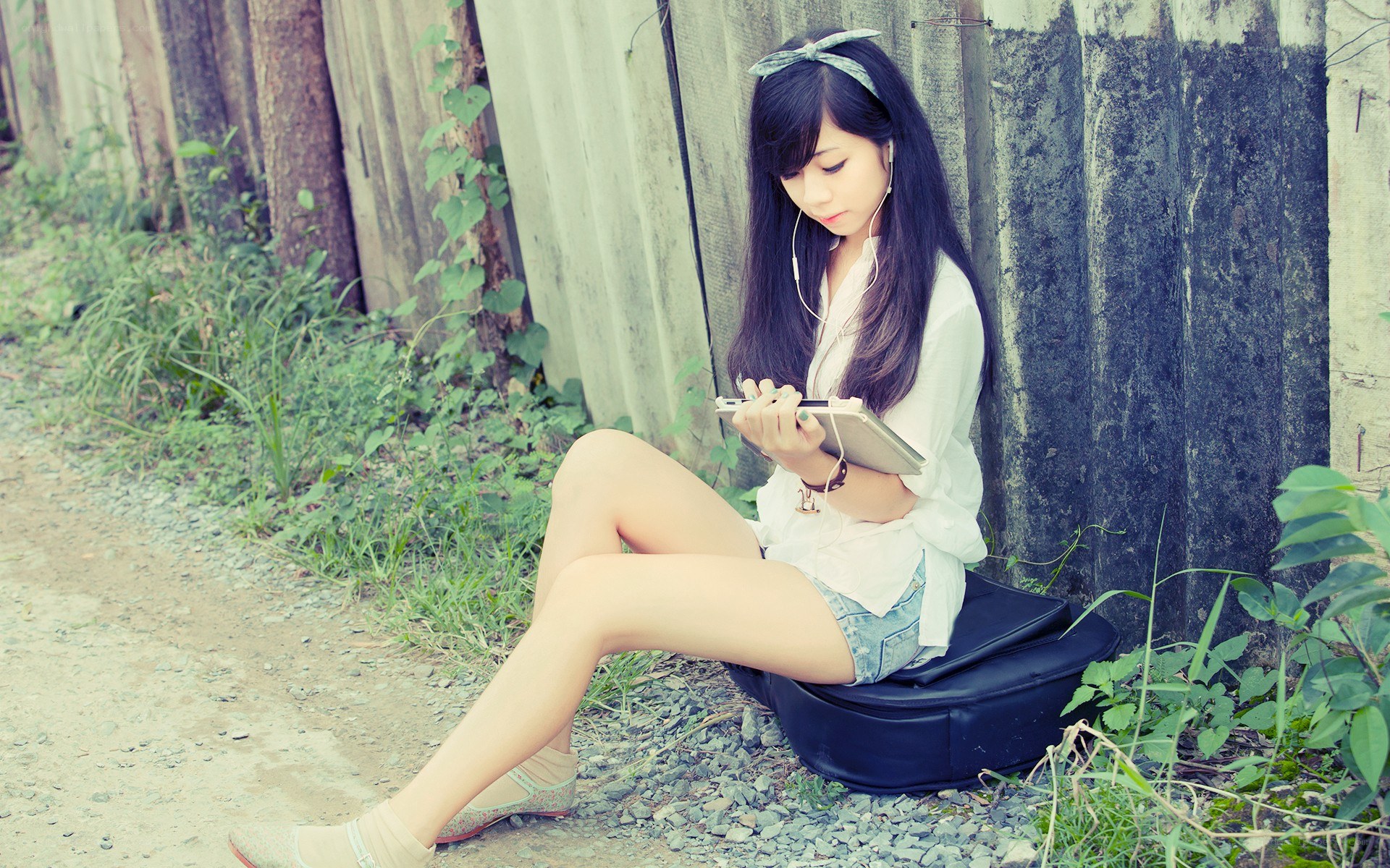 woman using tablet outdoors