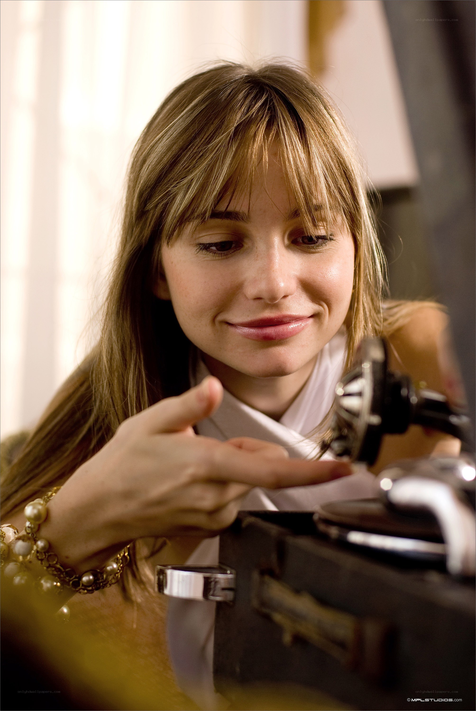 woman using vintage record player