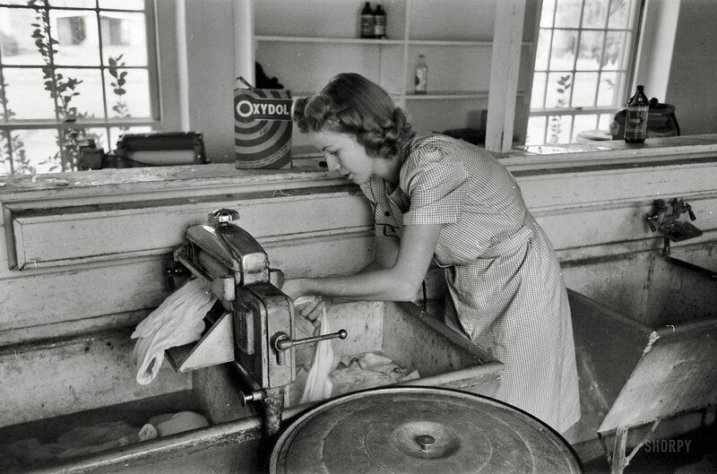 Woman using washing machine