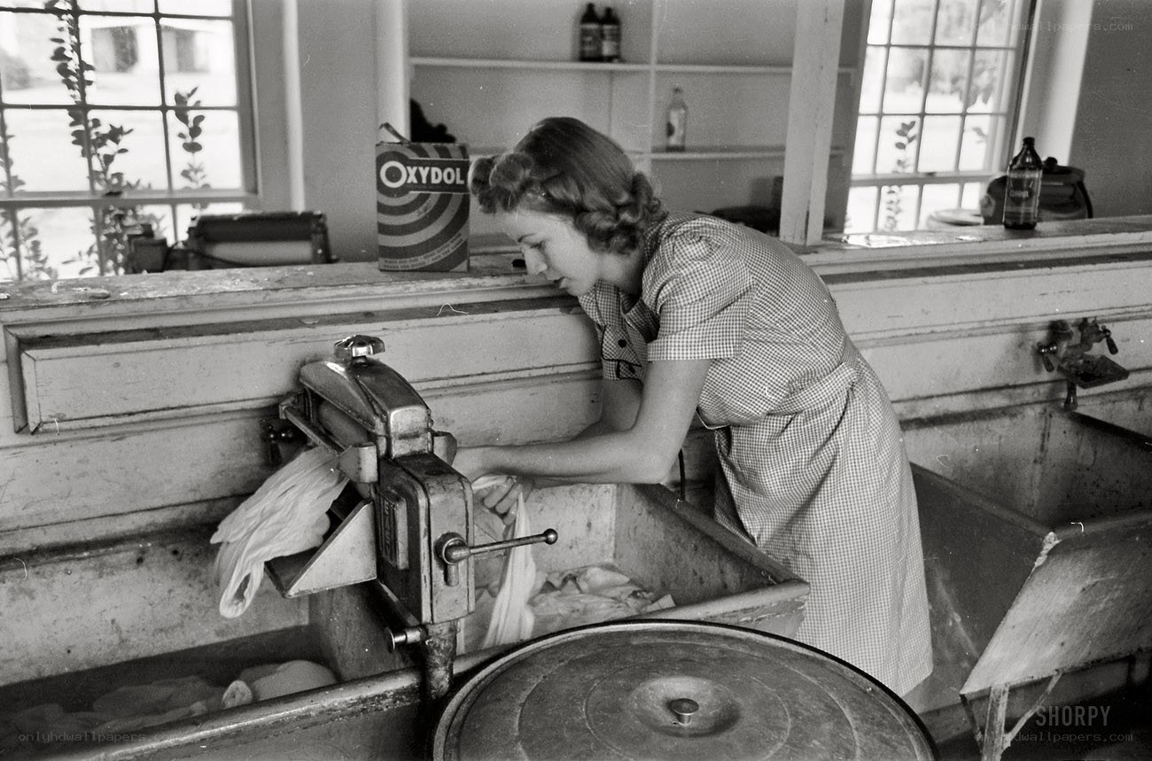 Woman using washing machine