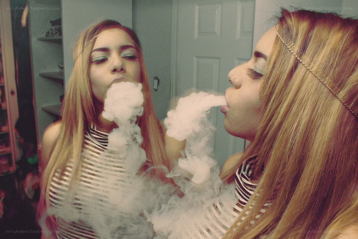 woman vaping in mirror
